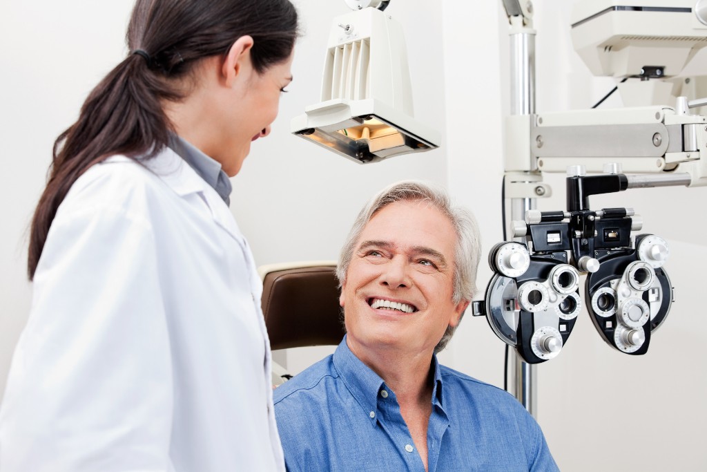 Patient Smiling While Doctor Inspects Eye